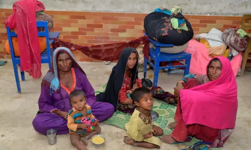  Cyclone evacuees look at the camera as they sheltered at a school camp in Badin district of Pakistan’s Sind province on June 13, 2023. AFP 