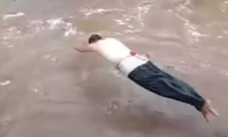 KP policeman rescue two boys trapped in floodwater