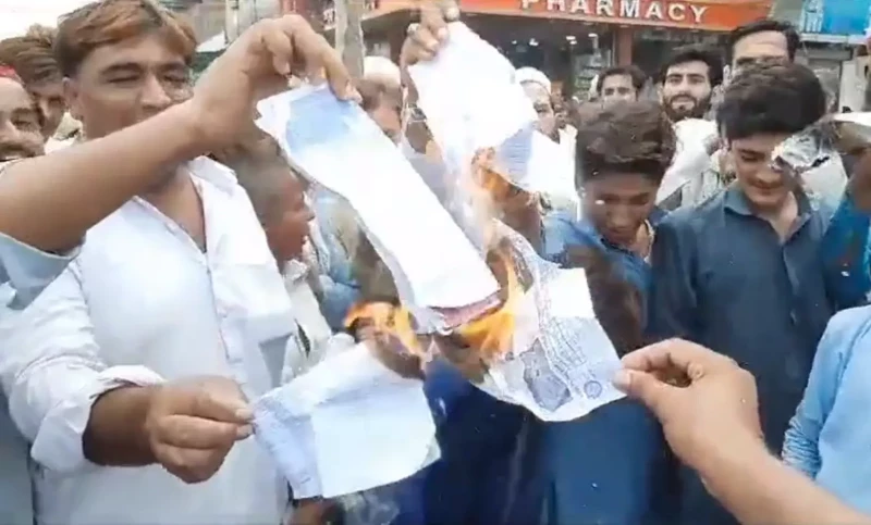 Protesters decrying price hike burn electricity bills in several cities