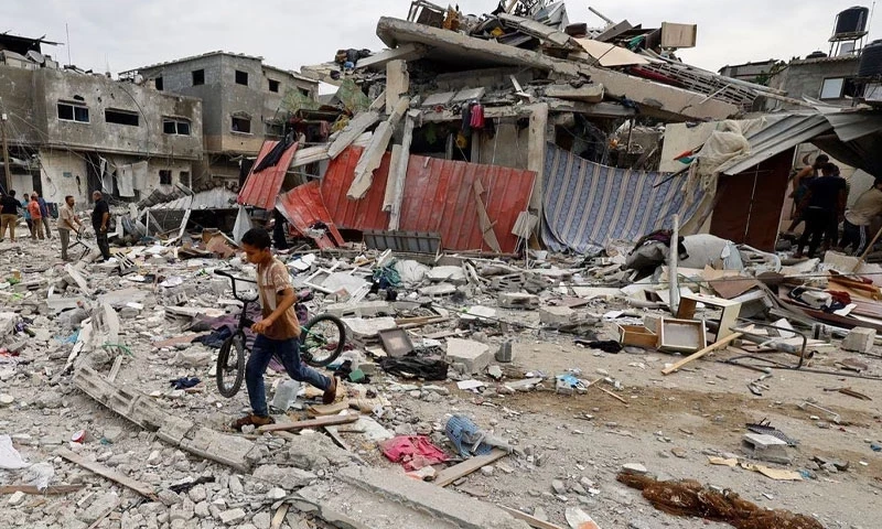 Israel forces still in Gaza as Palestianian death toll soars to 7,703