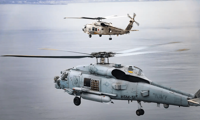 Two Japan navy helicopters crash, one body found, 7 missing