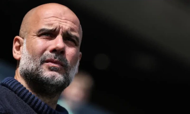 Guardiola urges Man City to seize chance to make Premier League history