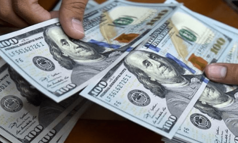 Dollar rises against rupee by slim margin