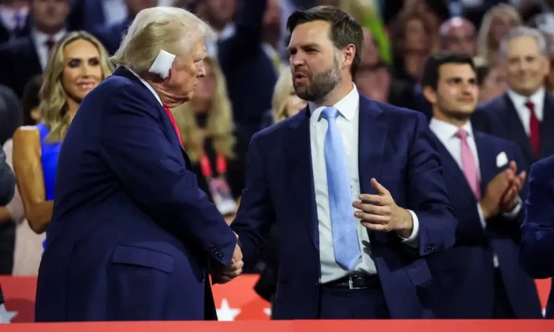 Trump appears with bandaged ear at Republican convention, announces JD Vance as running mate