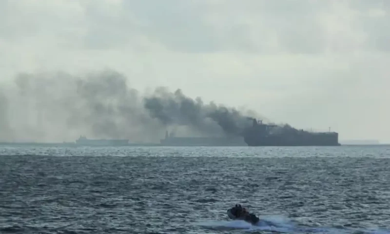 Oil tankers on fire after colliding off Singapore, crew members rescued