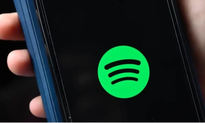 Spotify adds paid subscribers, beating estimates