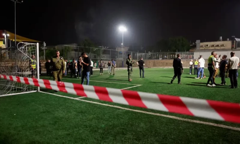 Israel says Hezbollah rocket kills 12 at football ground, vows response