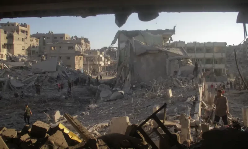 Israeli strikes kill 15 Palestinians in Gaza school, nine West Bank militants