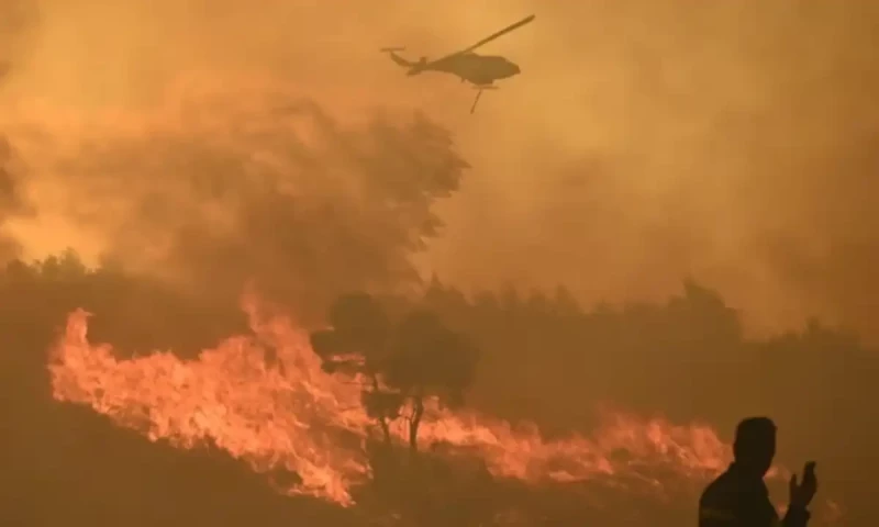 Wildfire erupts in Athens, thousands of people flee their homes