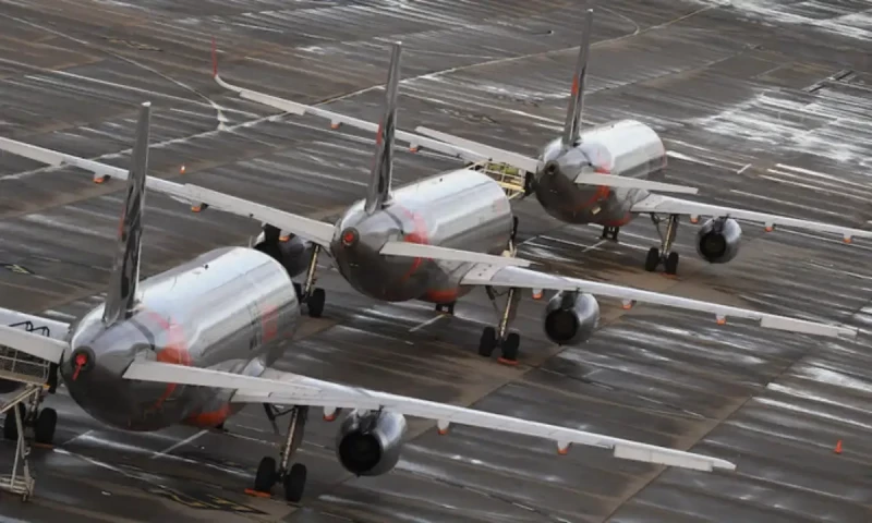 Unruly passenger arrested after exiting plane through emergency exit at Melbourne Airport