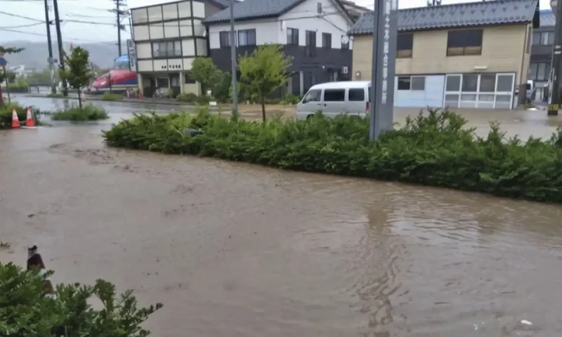 Japan orders mass evacuations amid heavy rains, flooding in quake-affected region