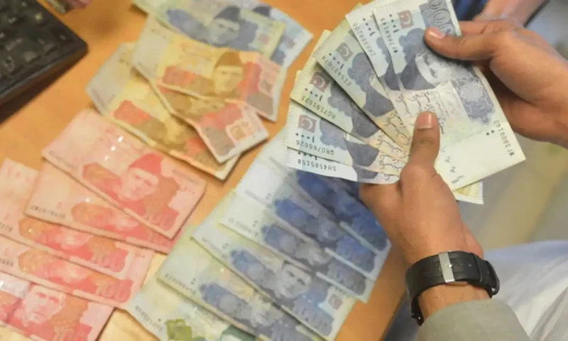 Rupee gains six paise against dollar