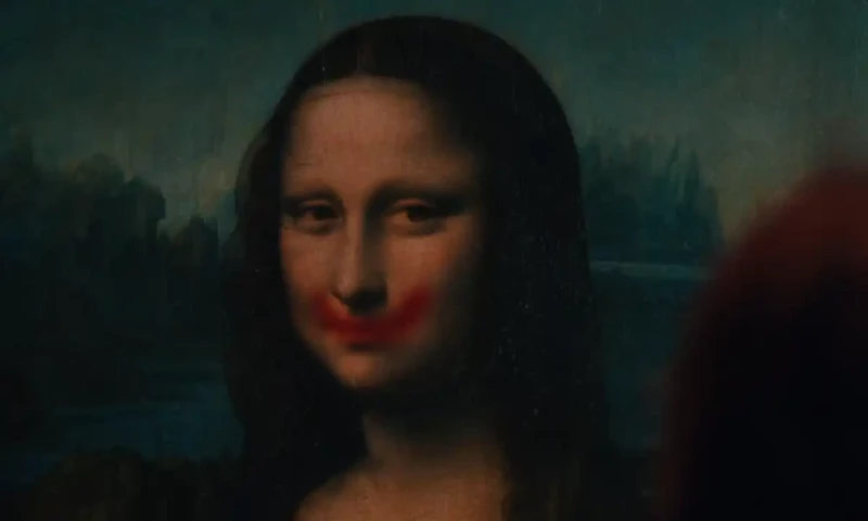 Video: Lady Gaga plants lipstick smile on &lsquo;Mona Lisa&rsquo;