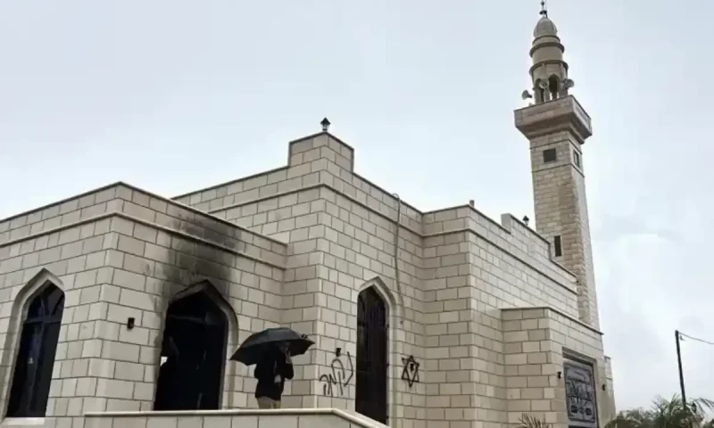 Palestinians accuse Israeli settlers of West Bank mosque fire