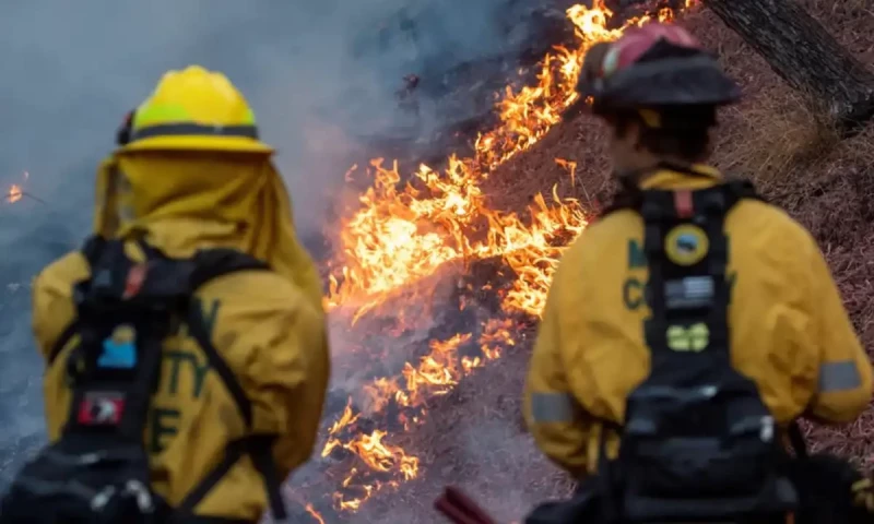 Firefighters race to beat LA blazes as winds grow and death toll hits 16
