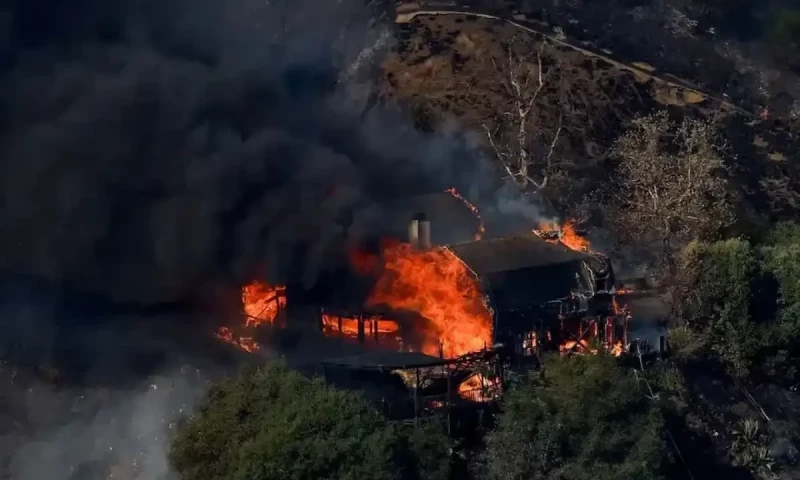Los Angeles wildfire switches direction, posing new threat