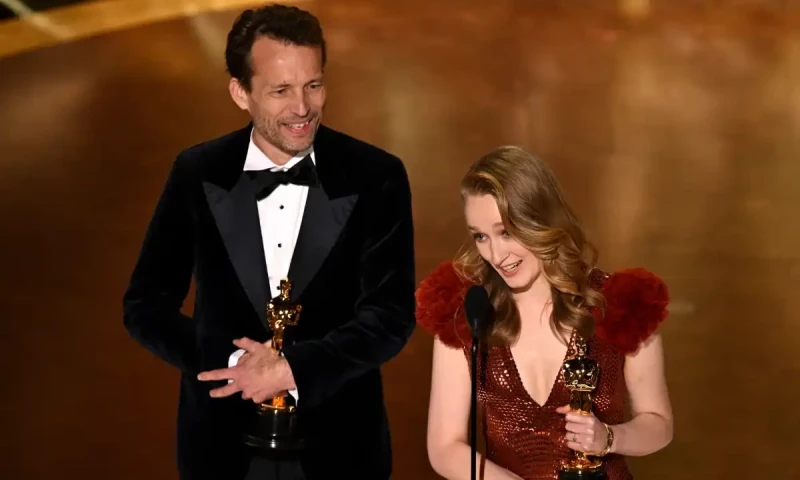 Producer Trent and writer-director Victoria Warmerdam accept the live action short award for I’m Not a Robot. AFP