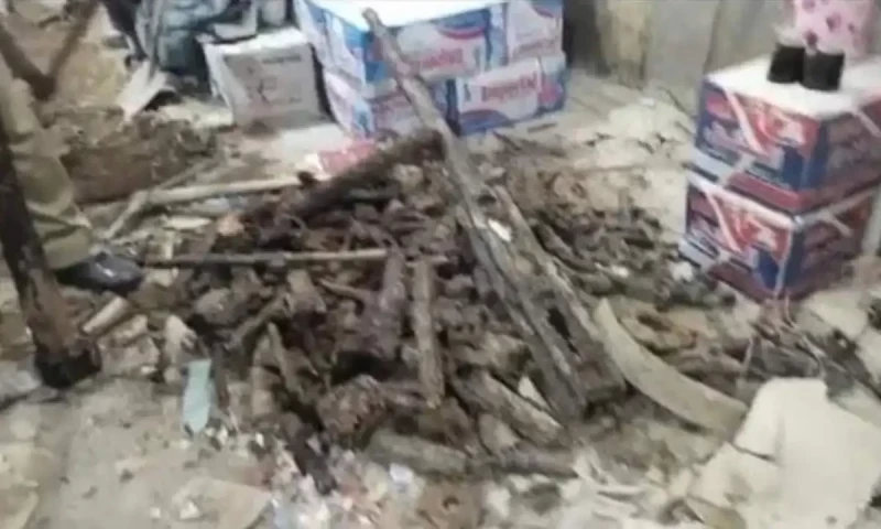 Cache of rusted weapons found buried in sacks during park excavation in Karachi
