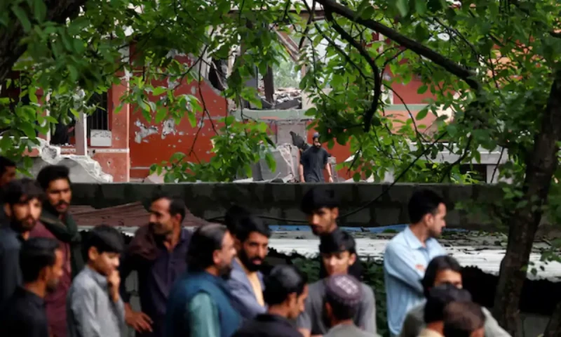  People gather next to a damaged portion of Bilal Mosque after it was hit by an Indian strike in Muzaffarabad, the capital of Pakistan-administered Kashmir, May 7, 2025. Reuters 