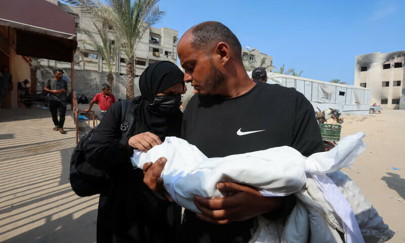 Israa Abu Haleeb and Ahmed Abu Haleeb, the parents of Palestinian baby Zainab Abu Haleeb, who died due to malnutrition, mourn their daughter in Khan Younis, southern Gaza Strip. – Reuters