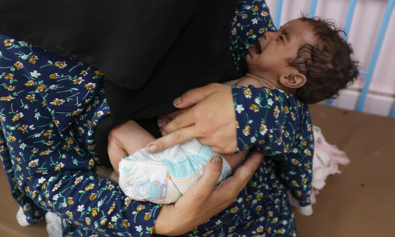 Palestinian woman Najla Abu Aya holds her five-month-old daughter Rama, who is malnourished, at Nasser Hospital in Khan Younis, southern Gaza Strip. – Reuters