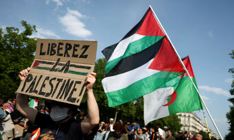A man holds a placard reading “Free Palestine” during a demonstration at the Place de la Republique in Paris, France. – Reuters file