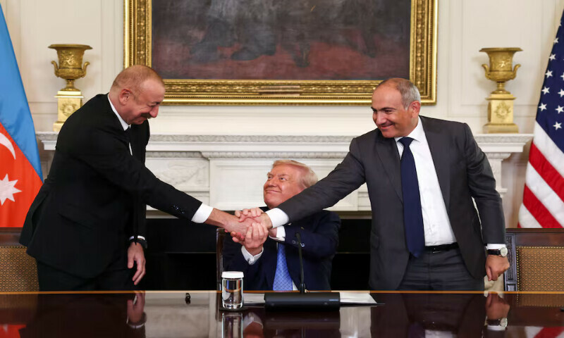 US President Donald Trump holds the hands of Azerbaijan’s President Ilham Aliyev and Armenia’s Prime Minister Nikol Pashinyan as they shake hands between each other during a trilateral signing event at the White House in Washington, DC. – Reuters