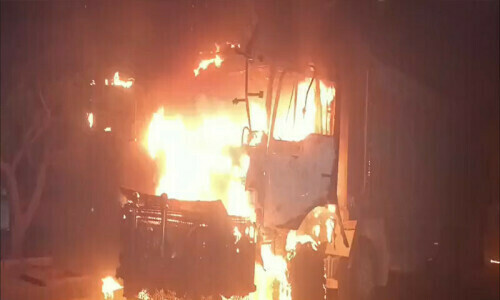 Seven dumpers set on fire after siblings crushed to death in Karachi