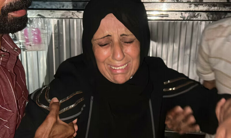 A relative of Al Jazeera journalist Mohammed Qreiqeh reacts in Gaza City on Monday. – Reuters