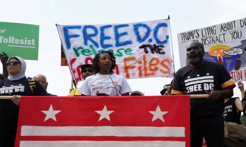 A demonstrator speaks during a protest near the White House in Washington DC. – Reuters
