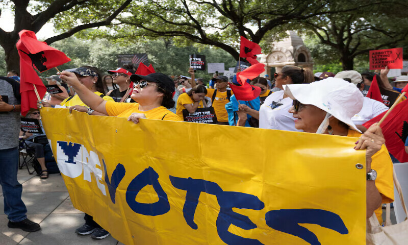 A group of protesters from the Rio Grande Valley listen to speakers during the Fight the Trump Takeover rally at in Austin, Texas, US. – Reuters