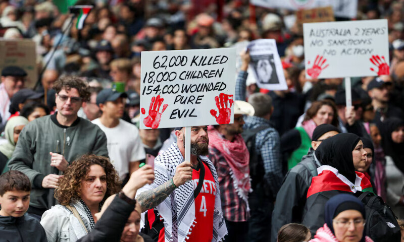 Demonstrators hold placards as they take part in the ‘Nationwide March for Palestine’ protest in Sydney, Australia, on Sunday. – Reuteres