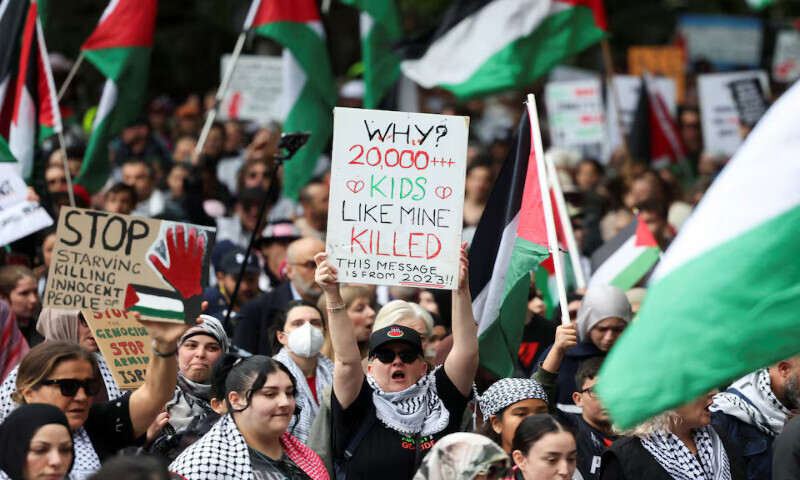 Demonstrators hold placards as they take part in the ‘Nationwide March for Palestine’ protest in Sydney, Australia, on Sunday. – Reuters