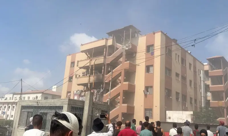 People walk at the site of Israeli strikes on Nasser hospital, where Palestinian cameraman Hussam Al Masri was killed along with other journalists and people in Khan Younis in the southern Gaza Strip. – Reuters