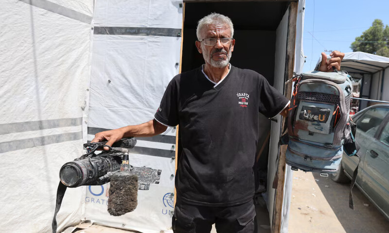 Ezzeldin Al Masri holds equipment used by his brother Hussam Al Masri, who was killed by an Israeli strike while operating a live video feed at Gaza’s Nasser Hospital in Khan Younis, southern Gaza Strip. – Reuters