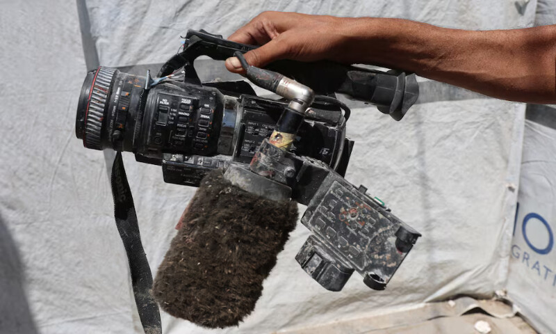 Ezzeldin Al Masri holds equipment used by his brother Hussam Al Masri in Khan Younis, southern Gaza Strip. – Reuters