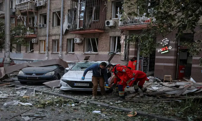 Medical workers evacuate a wounded person from an apartment building hit during Russian drone and missile strikes in Kyiv, Ukraine, on Thursday. – Reuters