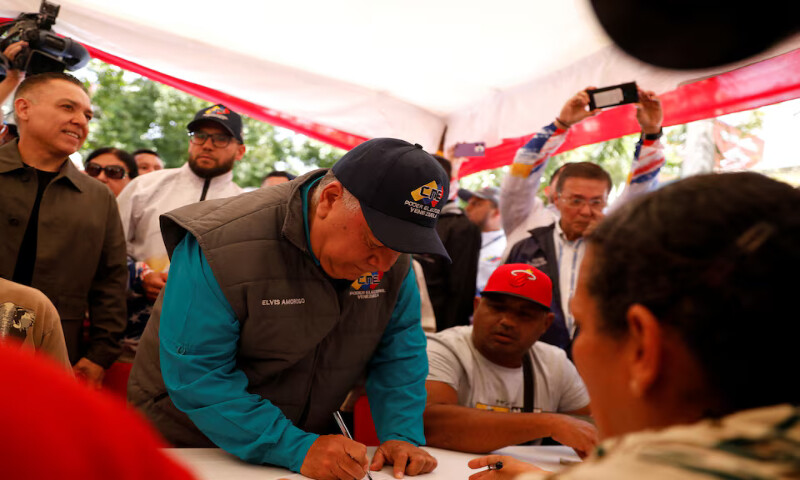 Elvis Hidrobo Amoroso, head of Venezuela’s National Electoral Council (CNE), enlists in the national militia following Venezuelan President Nicolas Maduro’s call for a nationwide recruitment drive amid rising tensions with the United States over the deployment of US warships in the Southern Caribbean and nearby waters. – Reuters