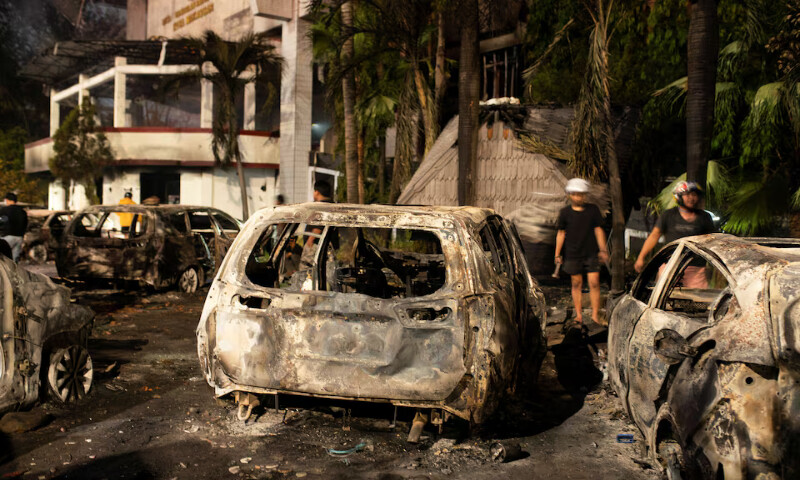 Cars are burnt on the regional parliament premises during a protest against parliamentarians’ allowances in Makassar, South Sulawesi province, Indonesia. – Reuters