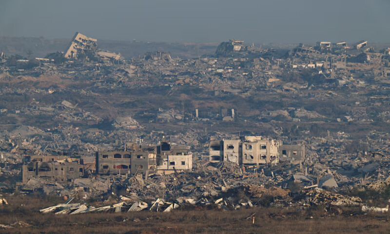 Destroyed buildings in Gaza, as seen from the Israeli side of the border, on Sunday. – Reuters