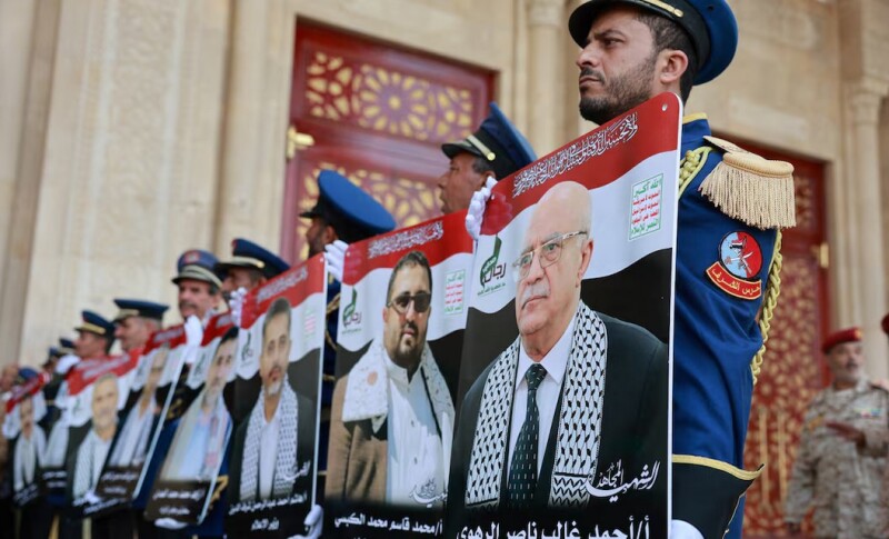 Honor guard hold photos of Prime Minister of Yemen’s Houthi-led government Ahmed Ghaleb Al-Rahwi and other Houthi government officials killed in an Israeli strike, during a funeral procession in Sanaa, Yemen September 1, 2025. REUTERS