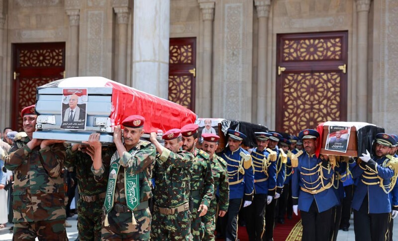 Military officers and Honour Guard carry the coffins of the Prime Minister of Yemen’s Houthi-led government Ahmed Ghaleb Al-Rahwi and other Houthi government officials killed in an Israeli strike, during a funeral procession in Sanaa, Yemen, September 1, 2025. REUTERS