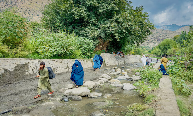 Afghan people walk towards a safer place after their house got damaged in the deadly earthquake at Lulam village, in Nurgal district, Kunar province, Afghanistan. – Reuters