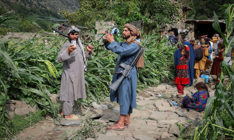 The Taliban officials take pictures of the devastated village of Mazar Dara following a deadly magnitude-6 earthquake in Afghanistan. – Reuters