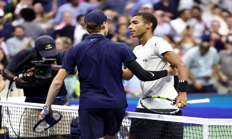 Jannik Sinner with Felix Auger-Aliassime after winning his semi-final match at the US Open in New York. – Reuters