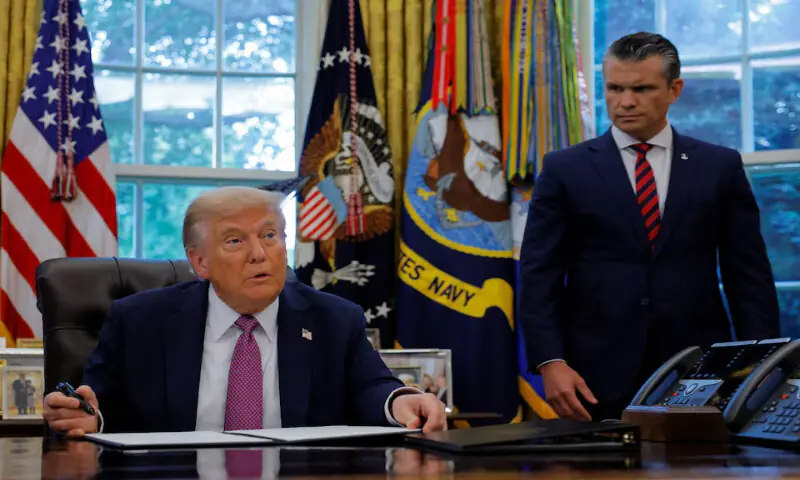 US President Donald Trump, accompanied by US Defence Secretary Pete Hegseth, speaks with the media while signing an executive order at the White House in Washington, DC. – Reuters