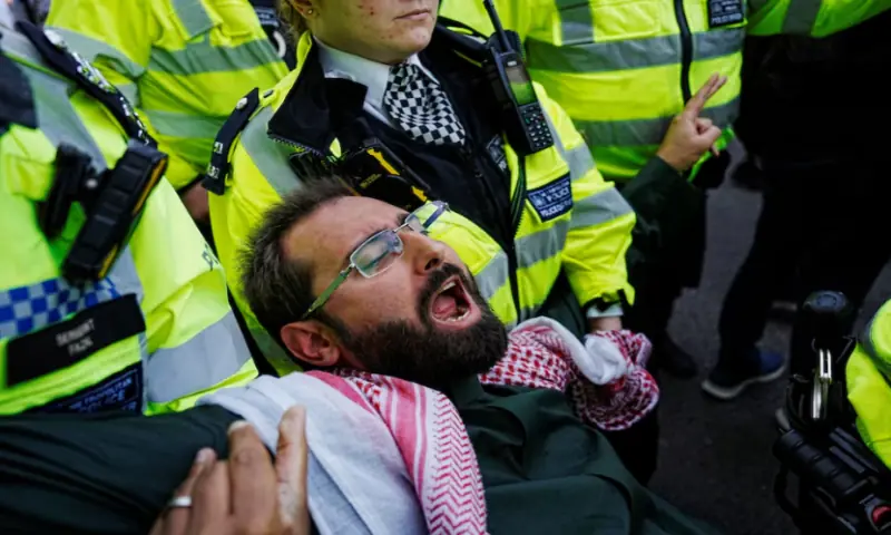 Police officers detain a demonstrator on the day of the ‘Lift The Ban’ rally organised by Defend Our Juries, challenging the British government’s proscription of ‘Palestine Action’ under anti-terrorism laws, in Parliament Square, in London, on September 6, 2025. Reuters