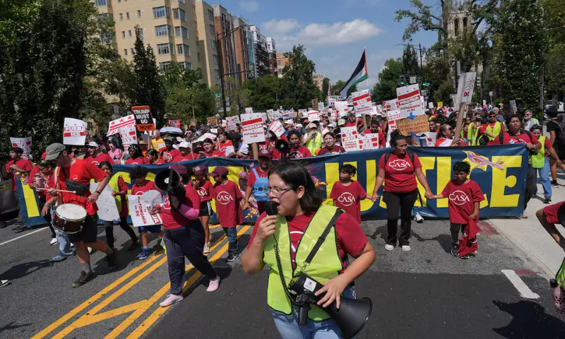 Demonstrators attend the “We Are All DC” march to protest against National Guard troops in Washington, DC. – Reuters