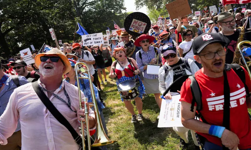Demonstrators attend the “We Are All DC” march, in Washington, DC. – Reuters