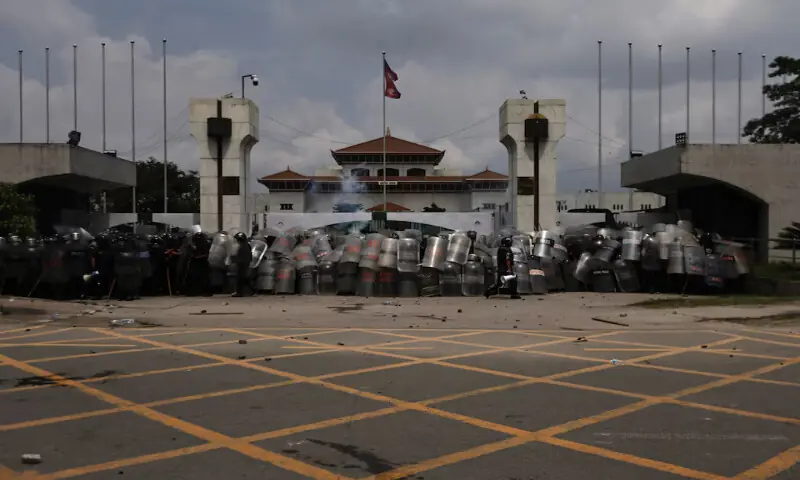 Police officers in riot gear guard the entrance of the Parliament during a protest against corruption and the government’s decision to block several social media platforms in Kathmandu, Nepal, on Monday. – Reuters